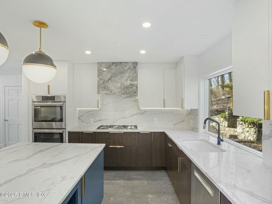 Interior, Kitchen, Marble Walls, Recessed Lighting, Stainless Steel Appliances