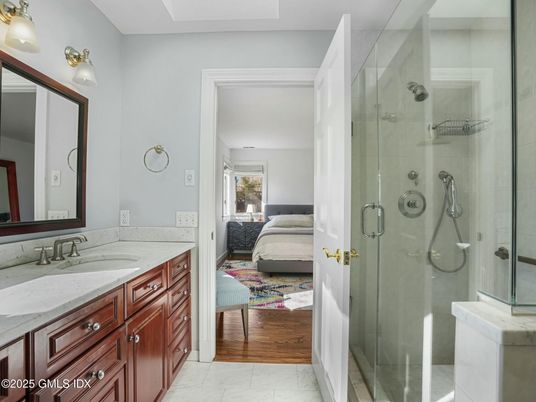 Bathroom, Bedroom, Dual Sink Vanities, Glass Shower, Interior, Marble, Wood Texture Flooring