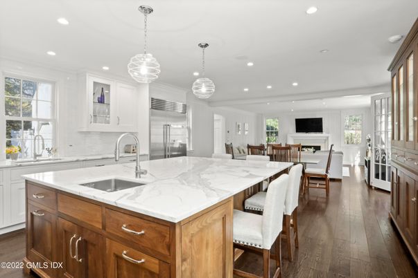Dining room, Fireplace, Interior, Kitchen, Pendant Lights, Recessed Lighting, Stainless Steel Appliances, Wood Texture Flooring