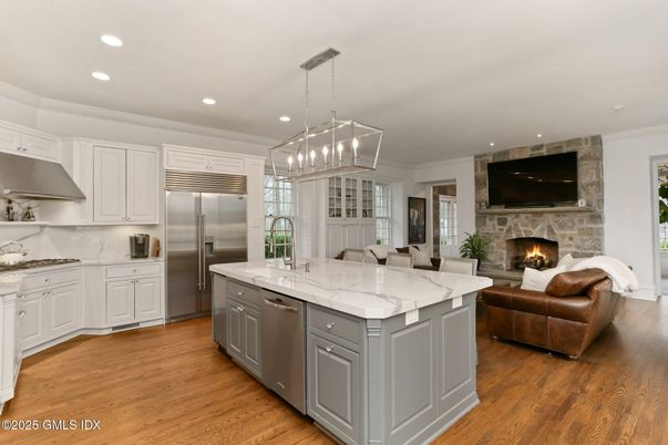 Fireplace, Interior, Kitchen, Pendant Lights, Recessed Lighting, Stainless Steel Appliances, Wood Texture Flooring