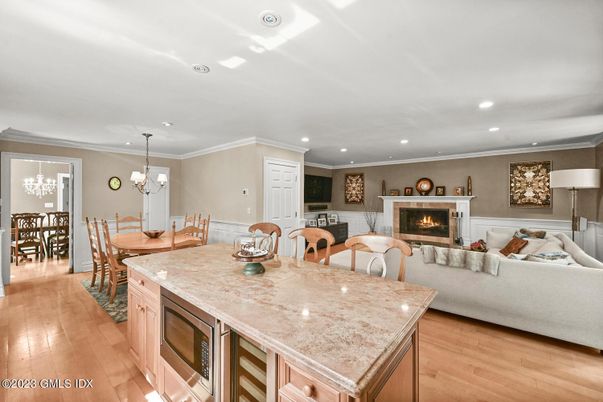 Chandelier, Dining room, Fireplace, Interior, Kitchen, Living room, Pendant Lights, Recessed Lighting, Wood Texture Flooring