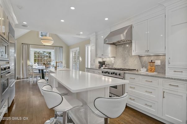 Dining room, Interior, Kitchen, Recessed Lighting, Stainless Steel Appliances, Wood Texture Flooring