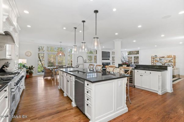 Dining room, Interior, Kitchen, Pendant Lights, Recessed Lighting, Stainless Steel Appliances, Wood Texture Flooring