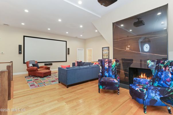 Fireplace, Interior, Living room, Projection Screen, Recessed Lighting, Wood Texture Flooring