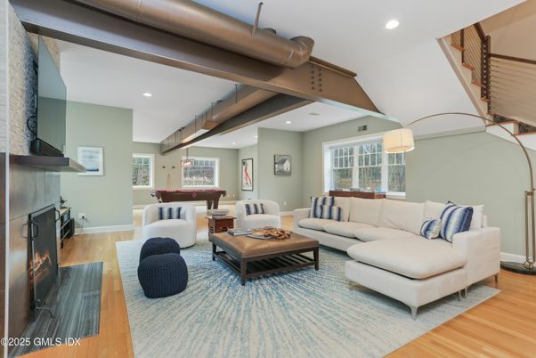 Billiard Table, Fireplace, Game Room, Interior, Living room, Pendant Lights, Recessed Lighting, Wood Texture Flooring