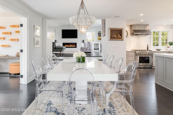 Chandelier, Dining room, Fireplace, Interior, Kitchen, Recessed Lighting, Stainless Steel Appliances, Wood Texture Flooring