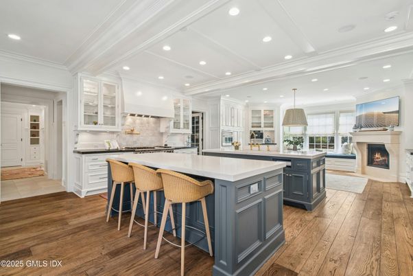Fireplace, Interior, Kitchen, Recessed Lighting, Stainless Steel Appliances, Wood Texture Flooring