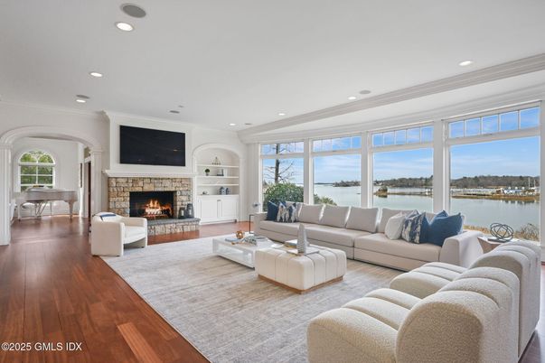 Fireplace, Interior, Living room, Recessed Lighting, Water, Wood Texture Flooring