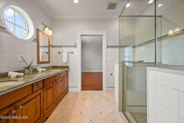 Bathroom, Dual Sink Vanities, Glass Shower, Interior, Recessed Lighting, Wood Texture Flooring