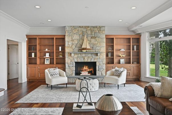 Fireplace, Interior, Living room, Recessed Lighting, Stone Walls, Wood Texture Flooring