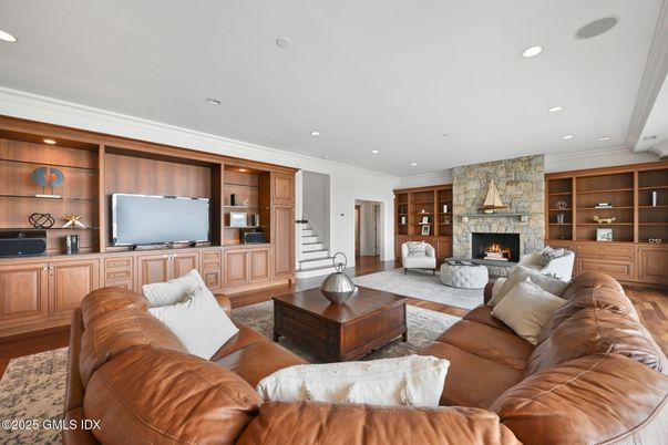 Fireplace, Interior, Living room, Recessed Lighting, Stone Walls, Wood Texture Flooring