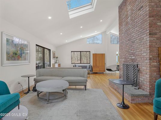 Fireplace, Interior, Living room, Recessed Lighting, Stone Walls, Wood Texture Flooring