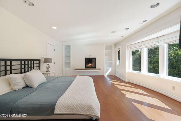 Bedroom, Fireplace, Interior, Recessed Lighting, Wood Texture Flooring