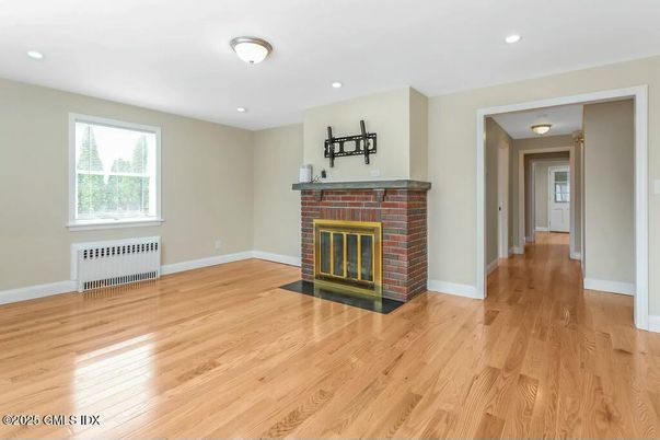 Empty room, Fireplace, Interior, Recessed Lighting, Wood Texture Flooring