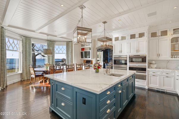 Dining room, Interior, Kitchen, Pendant Lights, Recessed Lighting, Stainless Steel Appliances, Water, Wood Texture Flooring