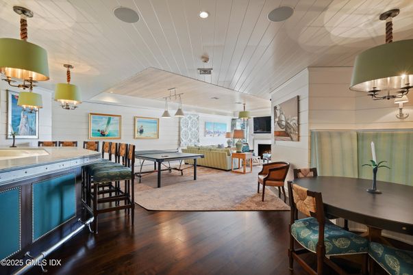 Dining room, Fireplace, Interior, Living room, Pendant Lights, Recessed Lighting, Wood Texture Flooring