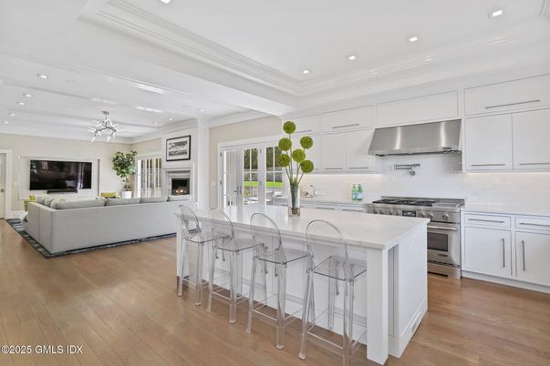 Fireplace, Interior, Kitchen, Living room, Recessed Lighting, Stainless Steel Appliances, Wood Texture Flooring