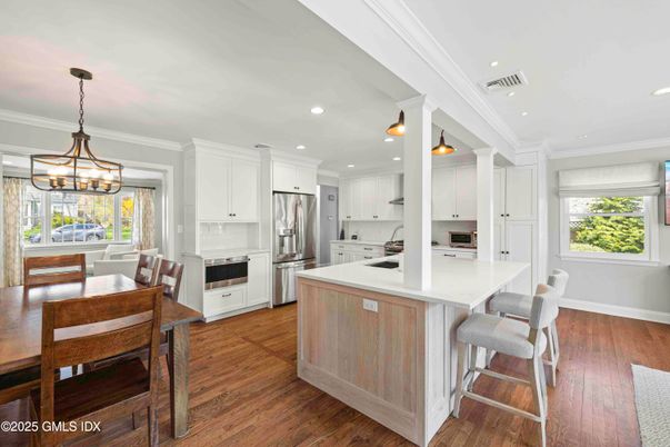 Dining room, Interior, Kitchen, Pendant Lights, Recessed Lighting, Stainless Steel Appliances, Wood Texture Flooring