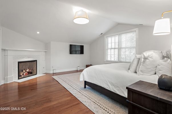 Bedroom, Fireplace, Interior, Recessed Lighting, Wood Texture Flooring
