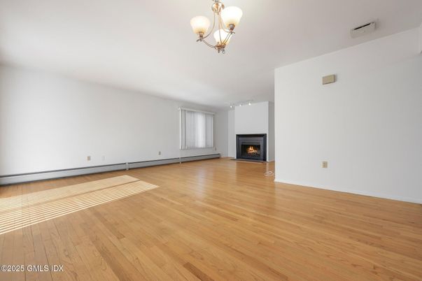 Chandelier, Empty room, Fireplace, Interior, Wood Texture Flooring