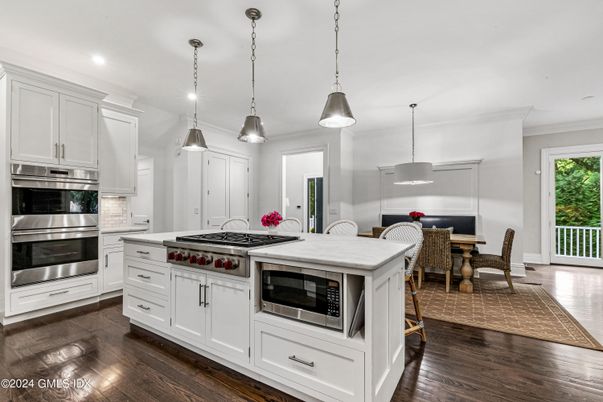 Dining room, Interior, Kitchen, Pendant Lights, Recessed Lighting, Stainless Steel Appliances, Wood Texture Flooring