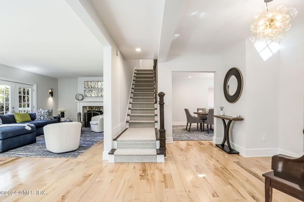 Dining room, Fireplace, Interior, Living room, Recessed Lighting, Wood Texture Flooring