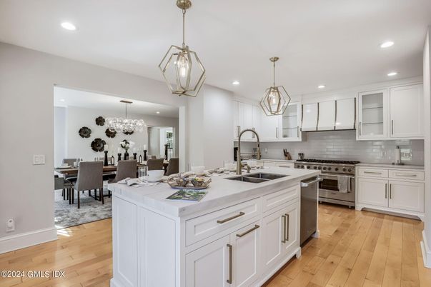 Chandelier, Dining room, Interior, Kitchen, Pendant Lights, Recessed Lighting, Stainless Steel Appliances, Wood Texture Flooring