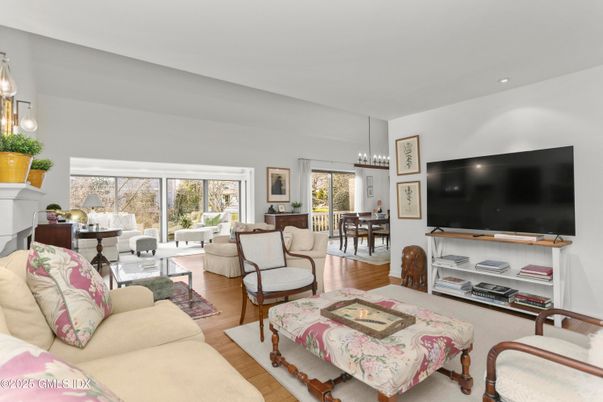 Chandelier, Dining room, Fireplace, Interior, Living room, Pendant Lights, Recessed Lighting, Wood Texture Flooring