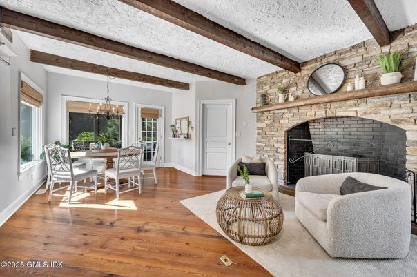 Chandelier, Dining room, Fireplace, Interior, Living room, Stone Walls, Wooden Beams, Wood Texture Flooring