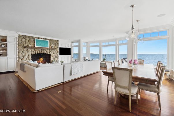Dining room, Fireplace, Interior, Living room, Pendant Lights, Stone Walls, Water, Wood Texture Flooring