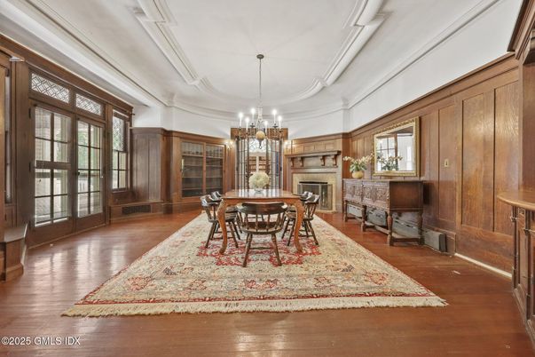 Chandelier, Dining room, Fireplace, Interior, Wood Texture Flooring, Wooden Walls