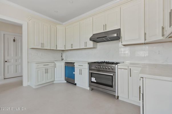 Interior, Kitchen, Marble Walls, Recessed Lighting, Stainless Steel Appliances