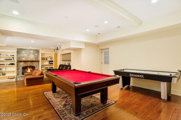 Billiard Table, Fireplace, Game Room, Interior, Recessed Lighting, Stone Walls, Wood Texture Flooring
