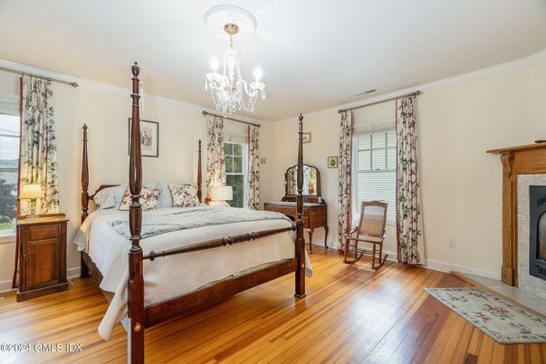 Bedroom, Chandelier, Fireplace, Interior, Wood Texture Flooring