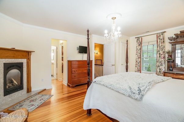 Bedroom, Chandelier, Fireplace, Interior, Wood Texture Flooring