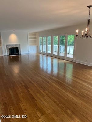 Chandelier, Empty room, Fireplace, Interior, Wood Texture Flooring
