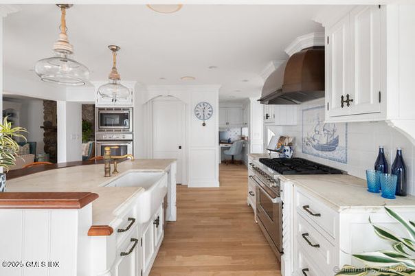 Fireplace, Interior, Kitchen, Recessed Lighting, Stainless Steel Appliances, Wood Texture Flooring