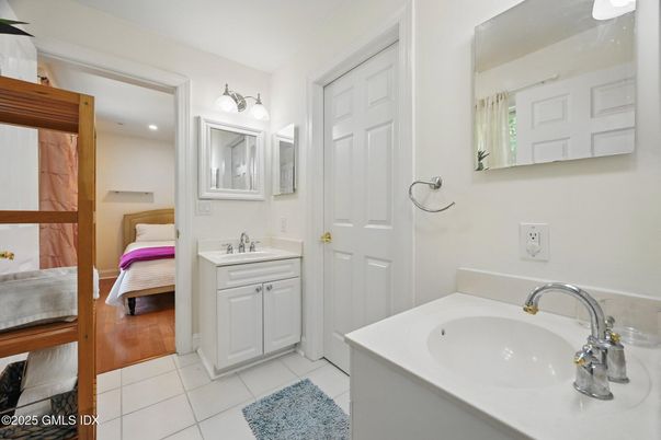 Bathroom, Dual Sink Vanities, Interior, Recessed Lighting, Wood Texture Flooring