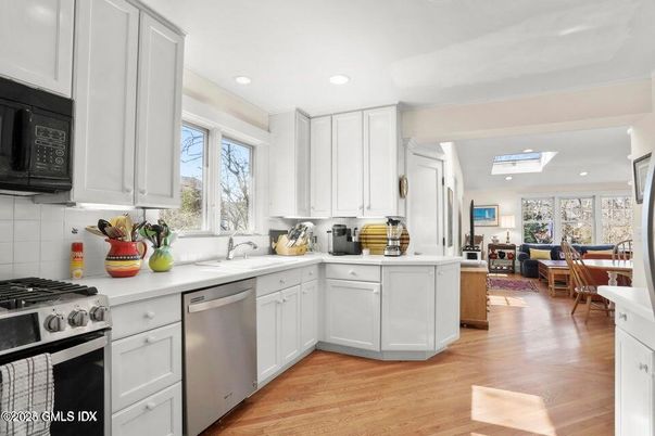 Dining room, Interior, Kitchen, Living room, Recessed Lighting, Stainless Steel Appliances, Wood Texture Flooring