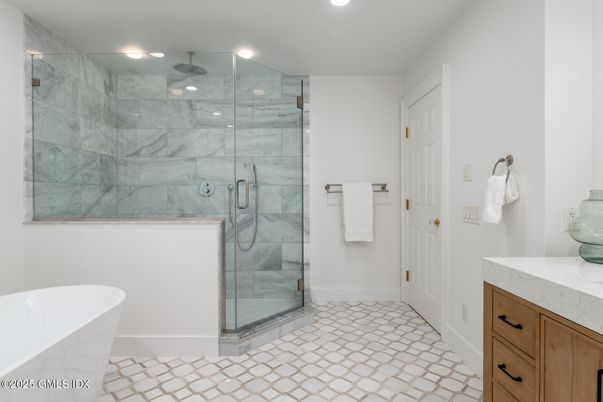 Bathroom, Free Standing Baths, Glass Shower, Interior, Marble Walls, Recessed Lighting