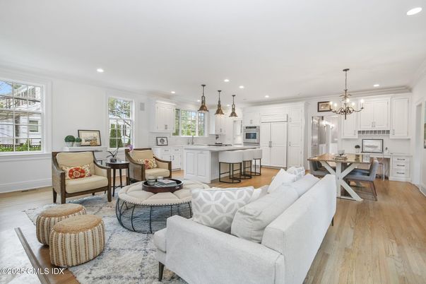 Chandelier, Dining room, Interior, Kitchen, Living room, Pendant Lights, Recessed Lighting, Stainless Steel Appliances, Wood Texture Flooring