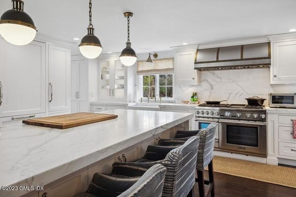 Interior, Kitchen, Marble Walls, Pendant Lights, Recessed Lighting, Stainless Steel Appliances, Wood Texture Flooring