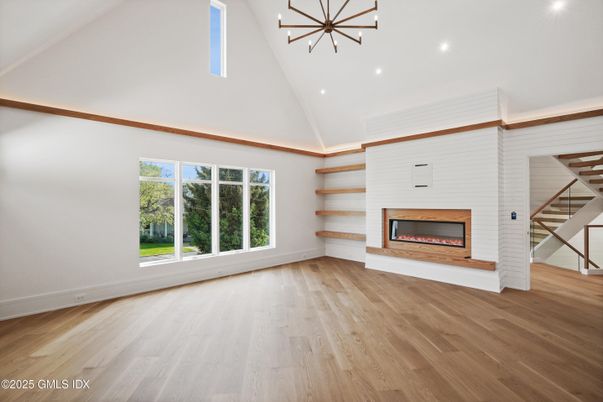 Empty room, Fireplace, Interior, Pendant Lights, Recessed Lighting, Wood Texture Flooring