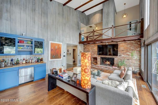 Fireplace, Interior, Living room, Pendant Lights, Recessed Lighting, Stone Walls, Wood Texture Flooring