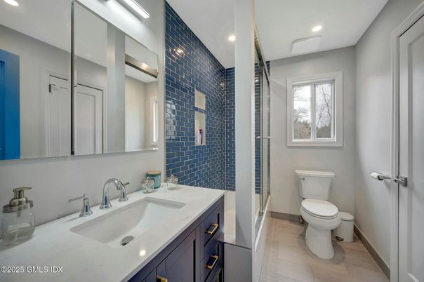 Bathroom, Dual Sink Vanities, Interior, Recessed Lighting, Wood Texture Flooring