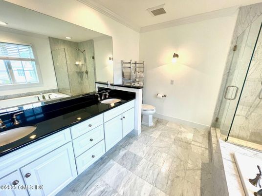 Bathroom, Dual Sink Vanities, Glass Shower, Interior, Marble, Marble Walls, Recessed Lighting