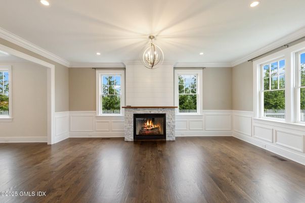 Empty room, Fireplace, Interior, Pendant Lights, Recessed Lighting, Wood Texture Flooring