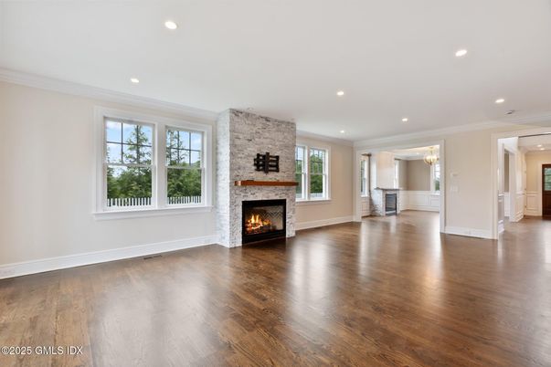Empty room, Fireplace, Interior, Recessed Lighting, Stone Walls, Wood Texture Flooring