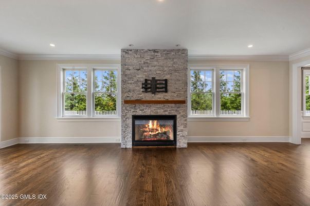 Empty room, Fireplace, Interior, Recessed Lighting, Stone Walls, Wood Texture Flooring