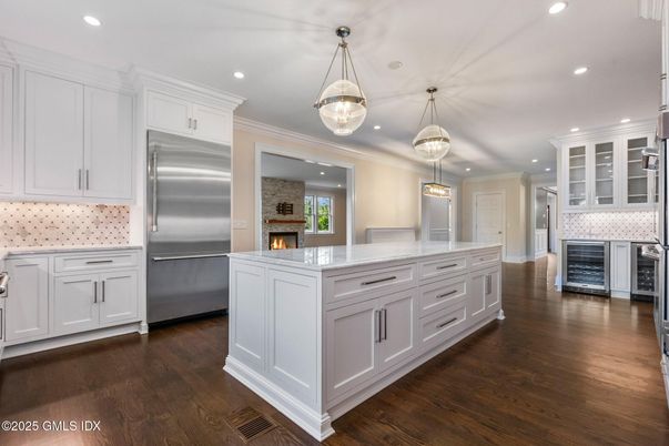Fireplace, Interior, Kitchen, Pendant Lights, Recessed Lighting, Stainless Steel Appliances, Wood Texture Flooring